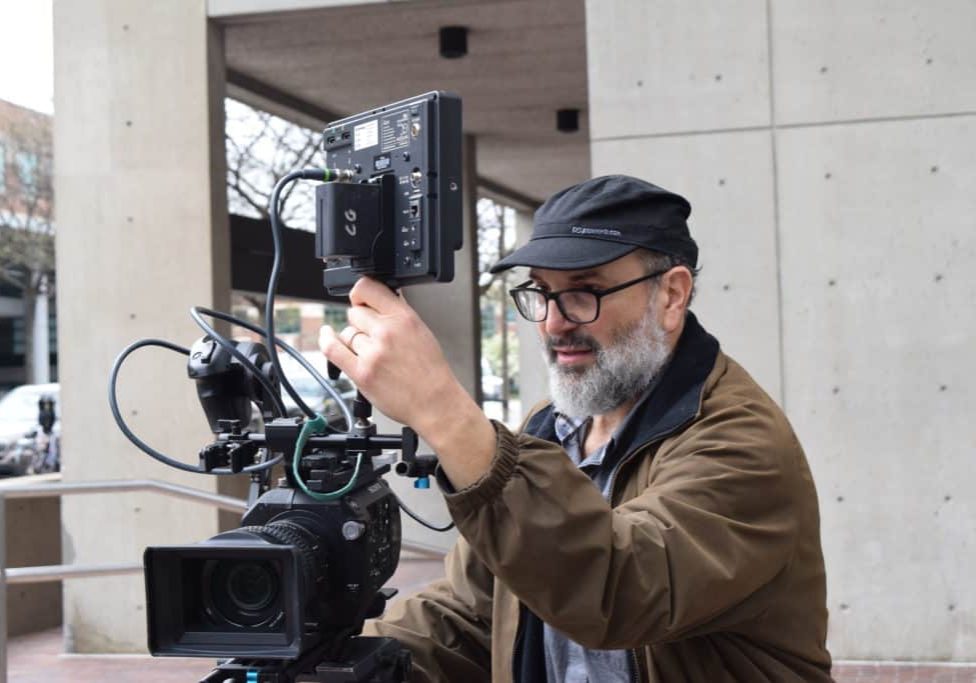 videographer working on a corporate video shoot